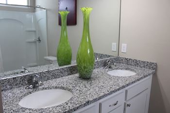 Double vanity and granite counters in master en suites
